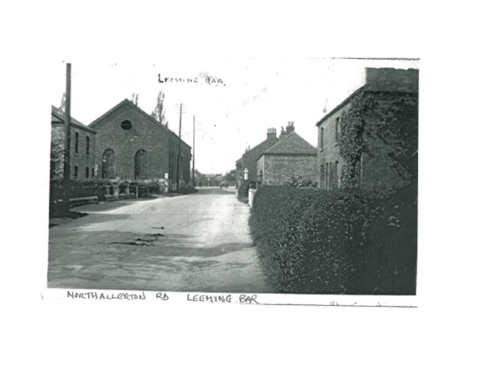 Taken on Northallerton Road, Leeming Bar, with the John H. Gill factory and old cottages. 